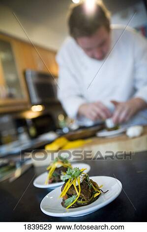 Chef preparing food View Large Photo Image Stock Photo - Chef preparing food. Fotosearch