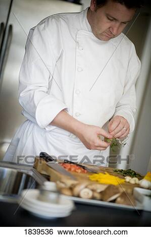 Chef preparing food View Large Photo Image Stock Photograph - Chef preparing food. Fotosearch