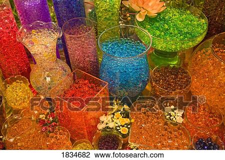 Stock Image - Colorful beads in glass jars. Fotosearch