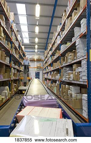 Conveyor belt and stocked shelves View Large Photo Image Stock Photography - Conveyor belt and stocked shelves. Fotosearch