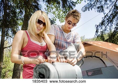 Stock Image - Couple going camping. Fotosearch