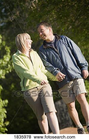 Stock Photo - Couple going for a walk. Fotosearch