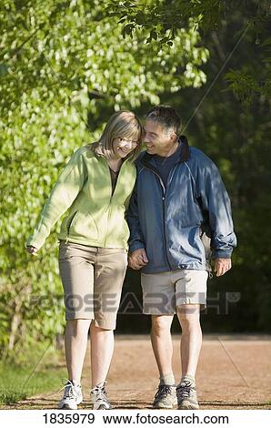 Couple going for a walk View Large Photo Image Stock Photo - Couple going for a walk. Fotosearch