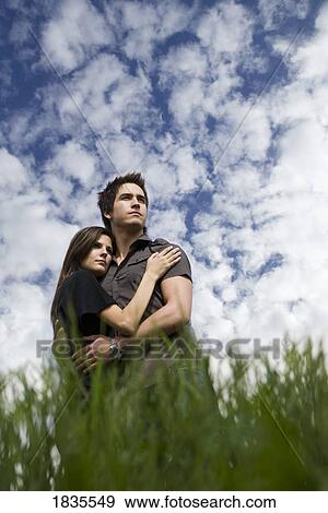 Stock Photo - Couple holding each other. Fotosearch