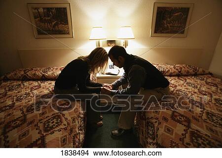 Picture - Couple praying together. Fotosearch