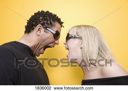 Couple yelling at each other View Large Photo Image Stock Image - Couple yelling at each other. Fotosearch