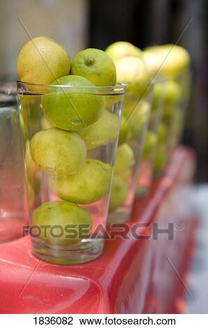 Stock Image - Delhi, India; Lemons and limes. Fotosearch