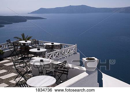 Stock Photograph - Dining with a view, Fira, Santorini, Greece . Fotosearch