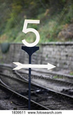 Stock Image - Directions at a railroad crossing. Fotosearch