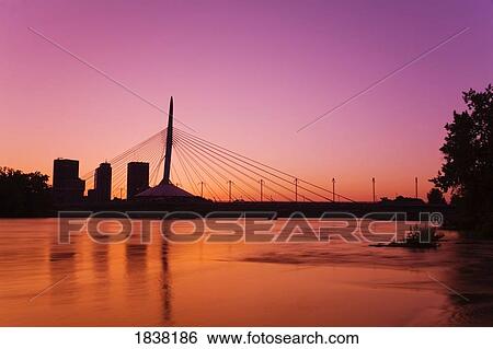Stock Photograph - Esplanade Riel Bridge over the Red River, Winnipeg, Manitoba, Canada . Fotosearch