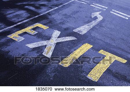 Stock Image - Exit sign painted on road . Fotosearch