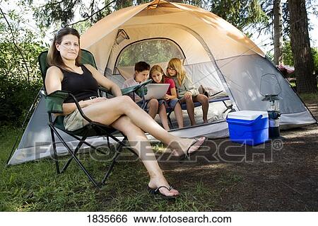 Family camping View Large Photo Image Stock Photograph - Family camping. Fotosearch