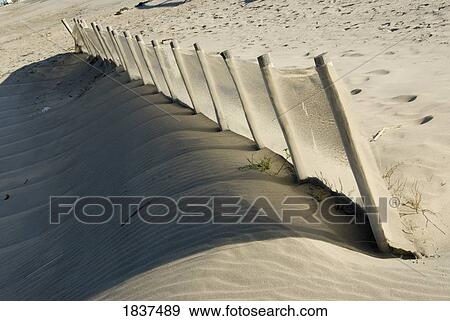 Fence posts on sandy hill View Large Photo Image Stock Photo - Fence posts on sandy hill. Fotosearch