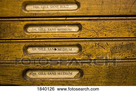 Stock Photograph - Gill Sans Bold type cases in drawers for letterpress printing. Fotosearch