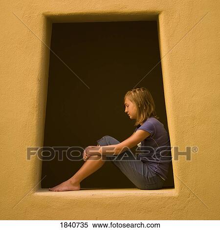 Girl sitting in a window View Large Photo Image Stock Photography - Girl sitting in a window. Fotosearch