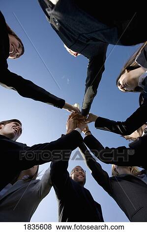 Group in business attire giving cheer View Large Photo Image Stock Photo - Group in business attire giving cheer. Fotosearch