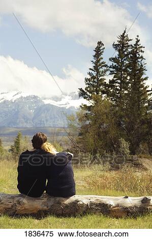 Jasper, Alberta, Canada; Couple looking at the mountains View Large Photo Image Stock Photography - Jasper, Alberta, Canada; Couple looking at the mountains. Fotosearch