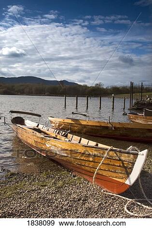 Lake District, Cumbria, England; rowboats on shore View Large Photo Image Stock Photo - Lake District, Cumbria, England; rowboats on shore. Fotosearch