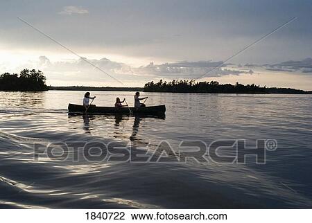 Stock Image - Lake of the Woods, Ontario, Canada; family in a canoe . Fotosearch