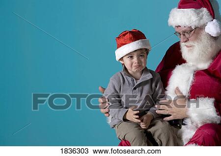 Little boy on Santa's lap View Large Photo Image Stock Image - Little boy on Santa's lap. Fotosearch