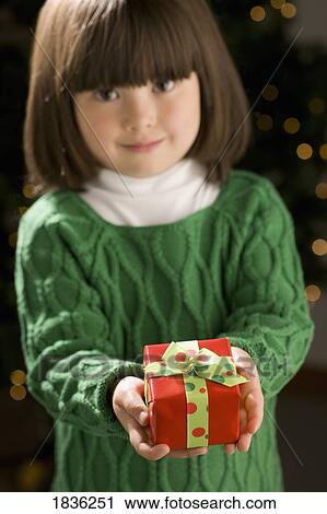 Little girl giving present View Large Photo Image Stock Image - Little girl giving present. Fotosearch