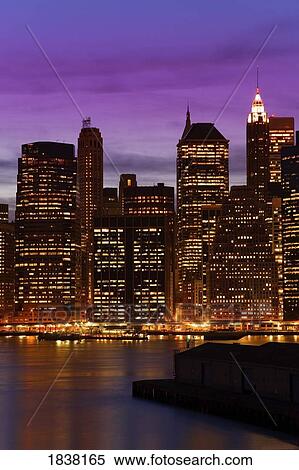 Stock Photography - Lower Manhattan Skyline at twilight, New York City, New York, USA . Fotosearch