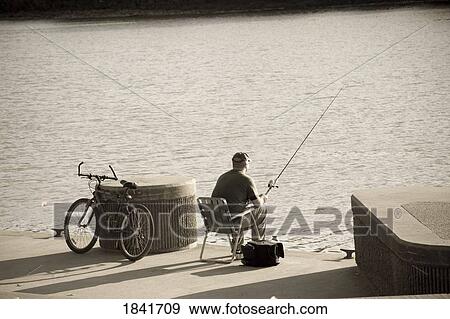 Stock Photo - Man fishing . Fotosearch