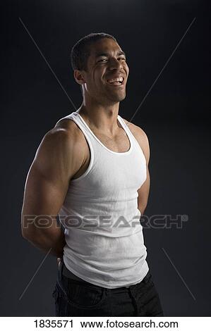 Man in muscle shirt View Large Photo Image Stock Image - Man in muscle shirt. Fotosearch