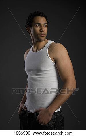 Man in muscle shirt View Large Photo Image Stock Photograph - Man in muscle shirt. Fotosearch