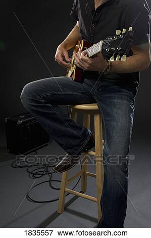 Stock Photo - Man playing guitar. Fotosearch