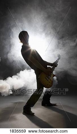Stock Photo - Man playing guitar. Fotosearch