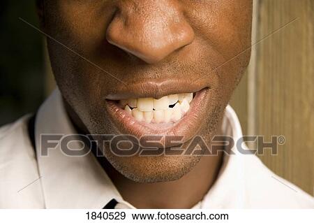 Man showing teeth View Large Photo Image Stock Photo - Man showing teeth. Fotosearch