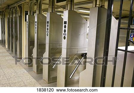 Manhattan, New York; Row of subway turnstiles View Large Photo Image Stock Image - Manhattan, New York; Row of subway turnstiles. Fotosearch
