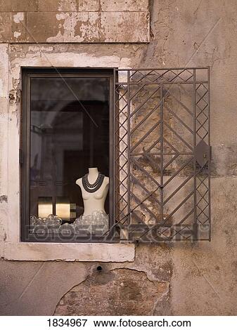 Stock Photo - Mannequin in window, Venice, Italy. Fotosearch