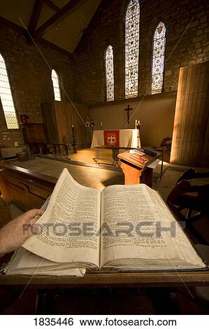 Stock Photograph - Open Bible in the chapel. Fotosearch
