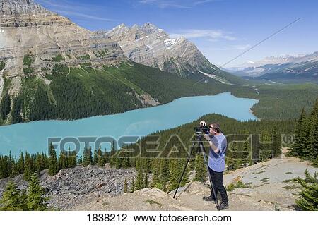 Peyto Lake, Banff National Park, Banff, Alberta, Canada; Photographer taking photos View Large Photo Image Stock Image - Peyto Lake, Banff National Park, Banff, Alberta, Canada; Photographer taking photos. Fotosearch