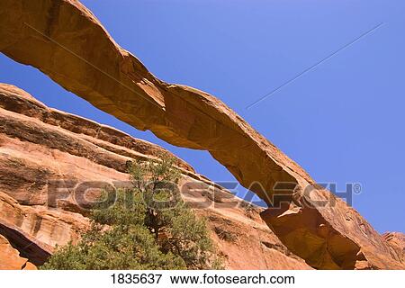 Stock Photo - Red arch in stone. Fotosearch