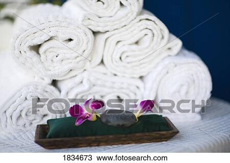 Rolled towels and spa rocks View Large Photo Image Stock Image - Rolled towels and spa rocks. Fotosearch