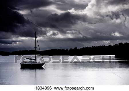 Sailboat in the water, Scotland View Large Photo Image Stock Photograph - Sailboat in the water, Scotland. Fotosearch