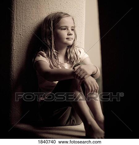 Stock Image - Sitting in a window. Fotosearch