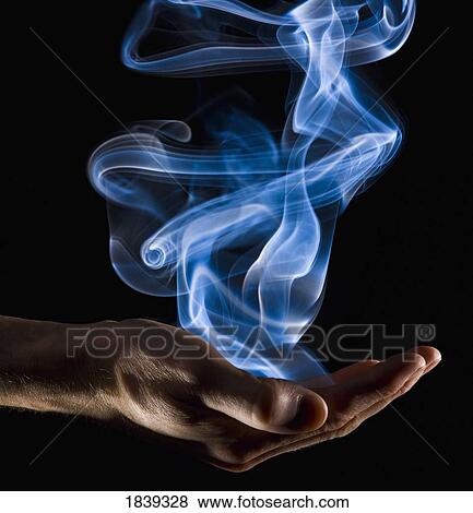 Smoke rising from a hand View Large Photo Image Stock Photo - Smoke rising from a hand. Fotosearch