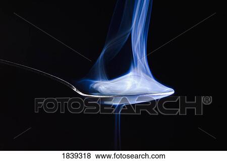 Smoke rising from a spoon View Large Photo Image Stock Photo - Smoke rising from a spoon. Fotosearch