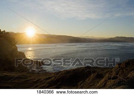 Stock Photograph - Sunrise, Cape Kiwanda, Pacific City, Oregon, USA . Fotosearch