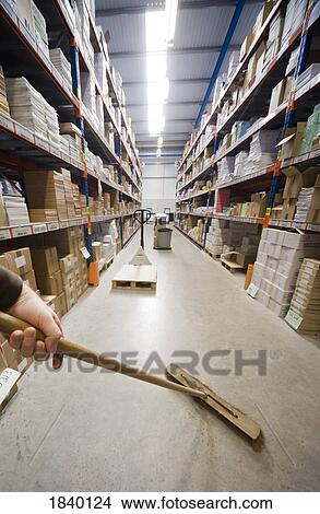 Sweeping the warehouse View Large Photo Image Picture - Sweeping the warehouse. Fotosearch