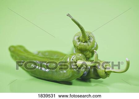 Stock Image - Three green chilis . Fotosearch
