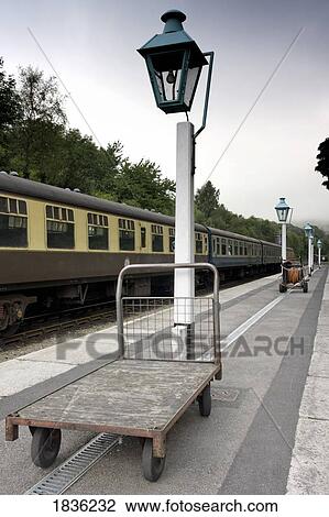 Stock Image - Train at a station, North Yorkshire, England. Fotosearch