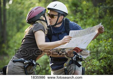 Two cyclists kissing View Large Photo Image Stock Photograph - Two cyclists kissing. Fotosearch