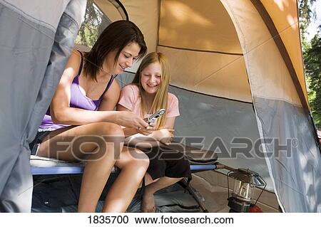 Two girls in a tent View Large Photo Image Stock Image - Two girls in a tent. Fotosearch