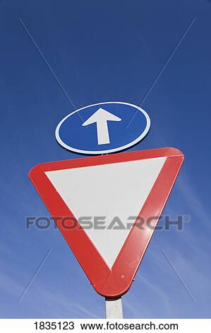 Two traffic signs: give way and straight ahead View Large Photo Image Stock Image - Two traffic signs: give way and straight ahead . Fotosearch