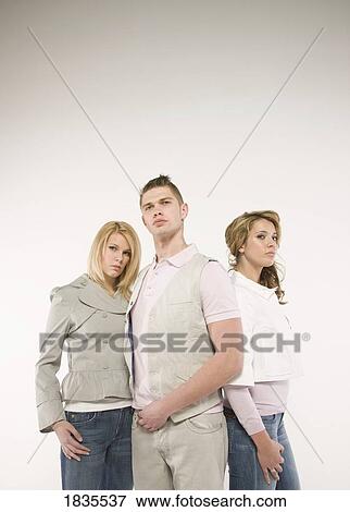 Two women and a man View Large Photo Image Stock Photo - Two women and a man. Fotosearch